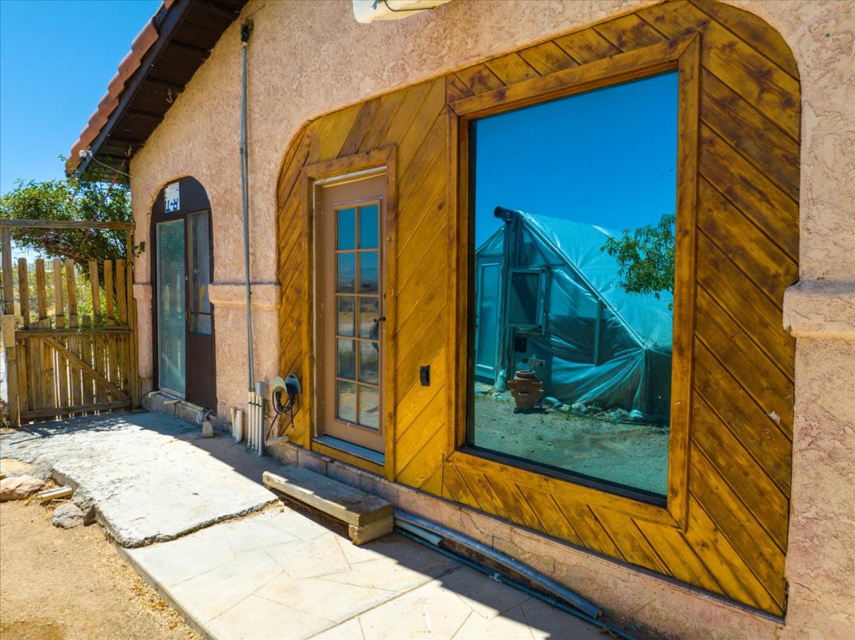 A greenhouse with its handmade wood window