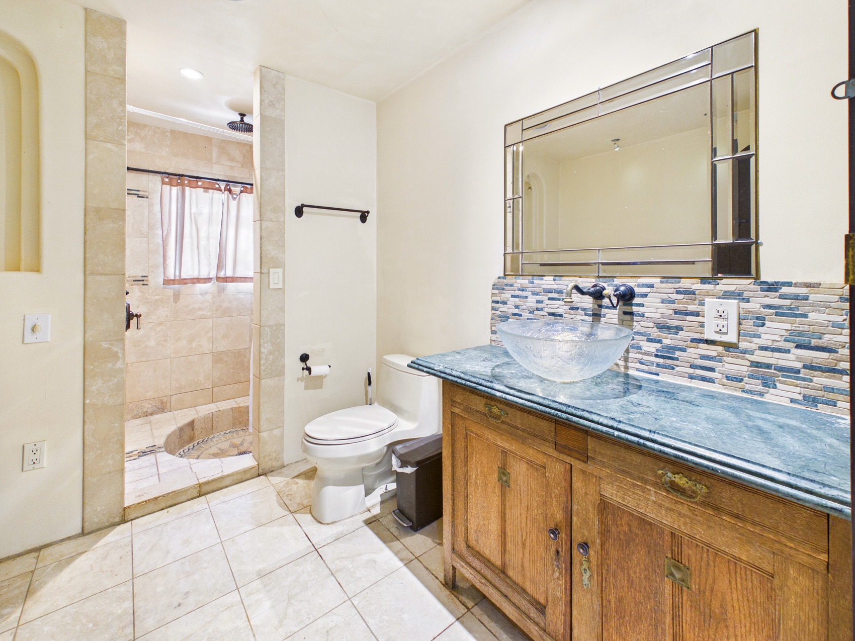 Walk-in shower and stone vanity
