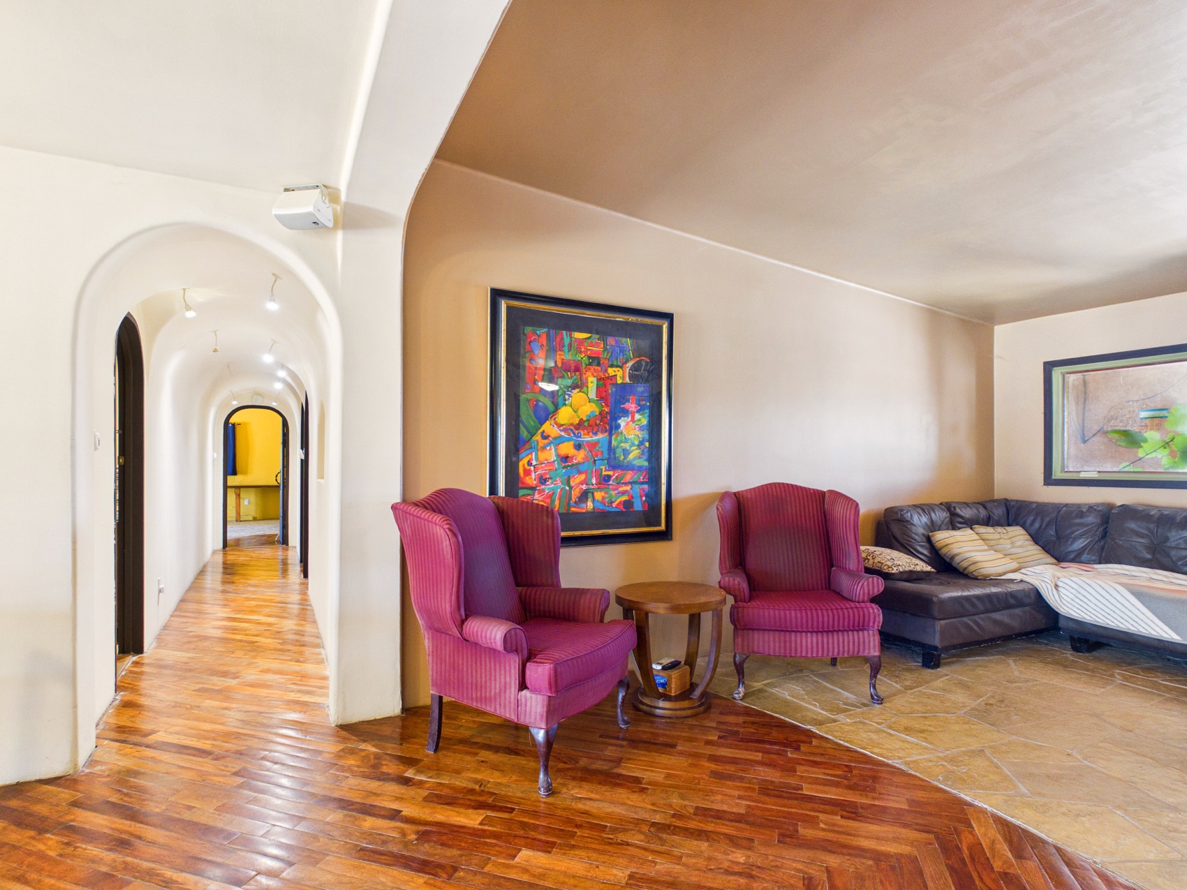 Seating and the arched hallway beyond