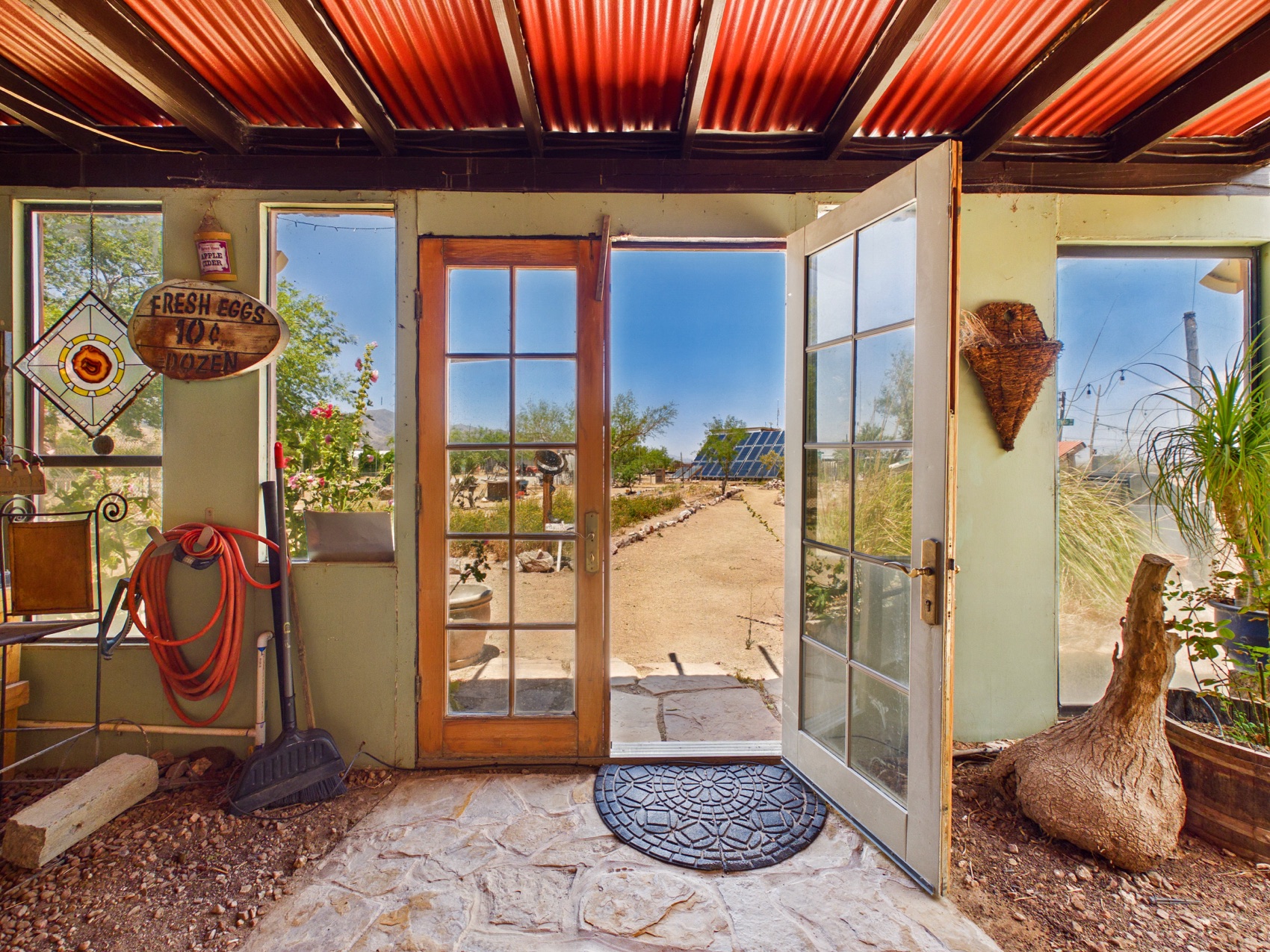 The sunroom, opening to the desert