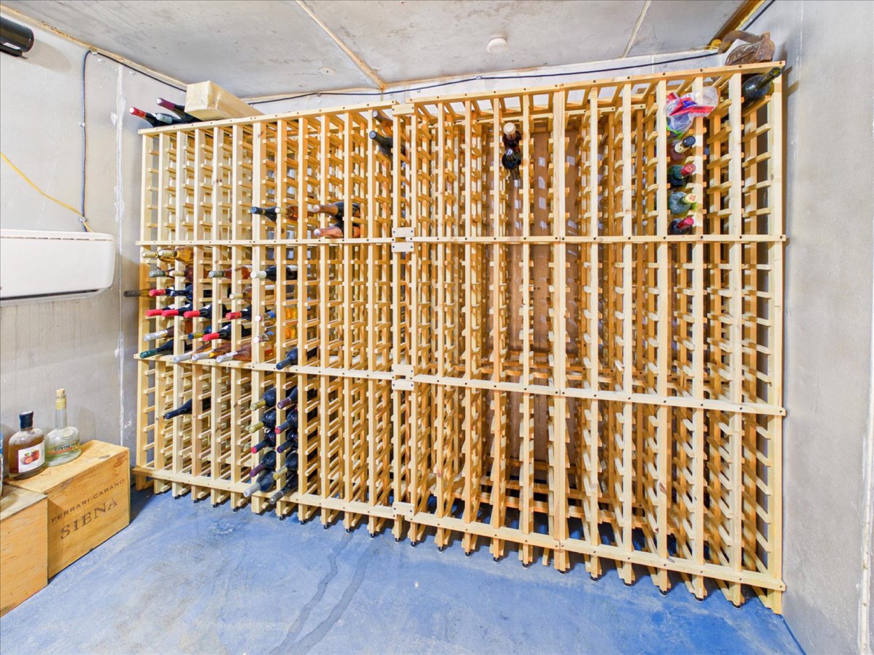 The walk-in wine cellar and its 818-bottle rack
